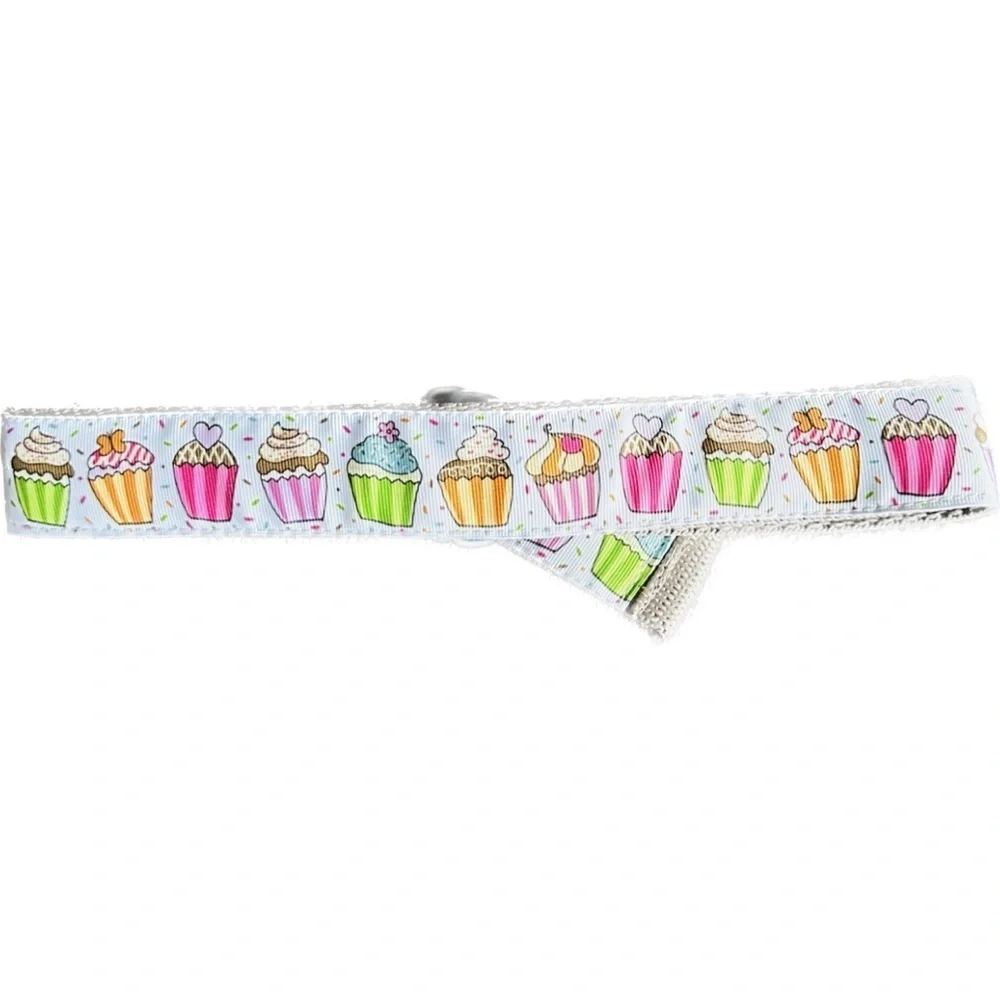 Belt, cupcakes and reverses to hearts on backside Celebrate in style.Adjustable